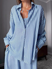 Blue striped button-up pajama set with cami and pants.