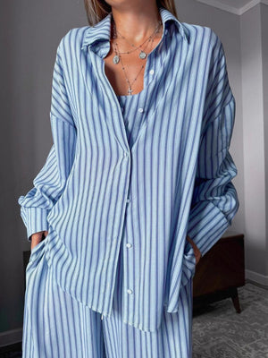 Blue striped button-up pajama set with cami and pants.