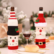 Festive knit bottle cosies in Santa and snowman designs, red and black.