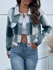 Green plaid shacket with patch pockets and button closure.
