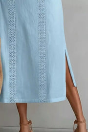 Light blue midi dress with lace trim and side slits.