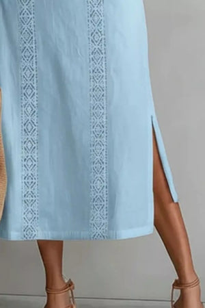 Light blue midi dress with lace trim and side slits.