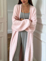 Plush pink maxi cardigan with balloon sleeves worn open over gray loungewear.