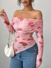 Pink ruched off-shoulder mesh top with floral print and asymmetrical hem.