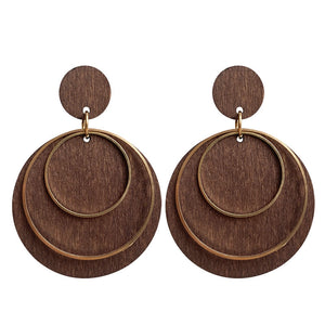 Wood and brass statement hoop earrings with layered circles.
