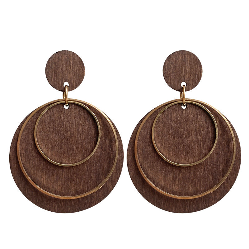 Wood and brass statement hoop earrings with layered circles.