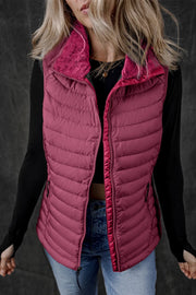 Quilted puffer vest in deep purple with a textured fleece collar and full zip front.