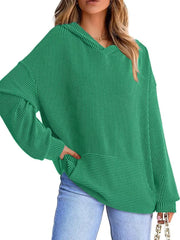 Green ribbed V-neck oversized hoodie sweatshirt with balloon sleeves and a front pocket.
