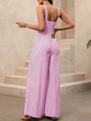 Blush pink striped cotton jumpsuit with smocked bodice and wide legs.