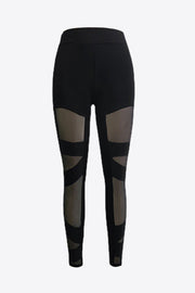 Black leggings with geometric mesh panels on the legs.