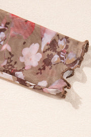 Sheer floral mesh blouse with lettuce edge cuff in floral cream.