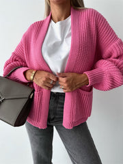 Hot Pink textured puff sleeve cardigan with pockets and ribbed cuffs.
