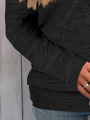 Black heathered knit off-the-shoulder top with long sleeves.