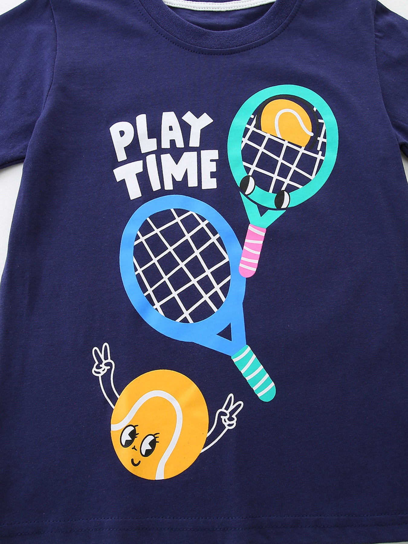 Navy cotton t-shirt with playful tennis graphic and "PLAY TIME" text.