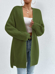 Longline knit open cardigan in green with ribbed details and subtle cutouts on the sleeves.