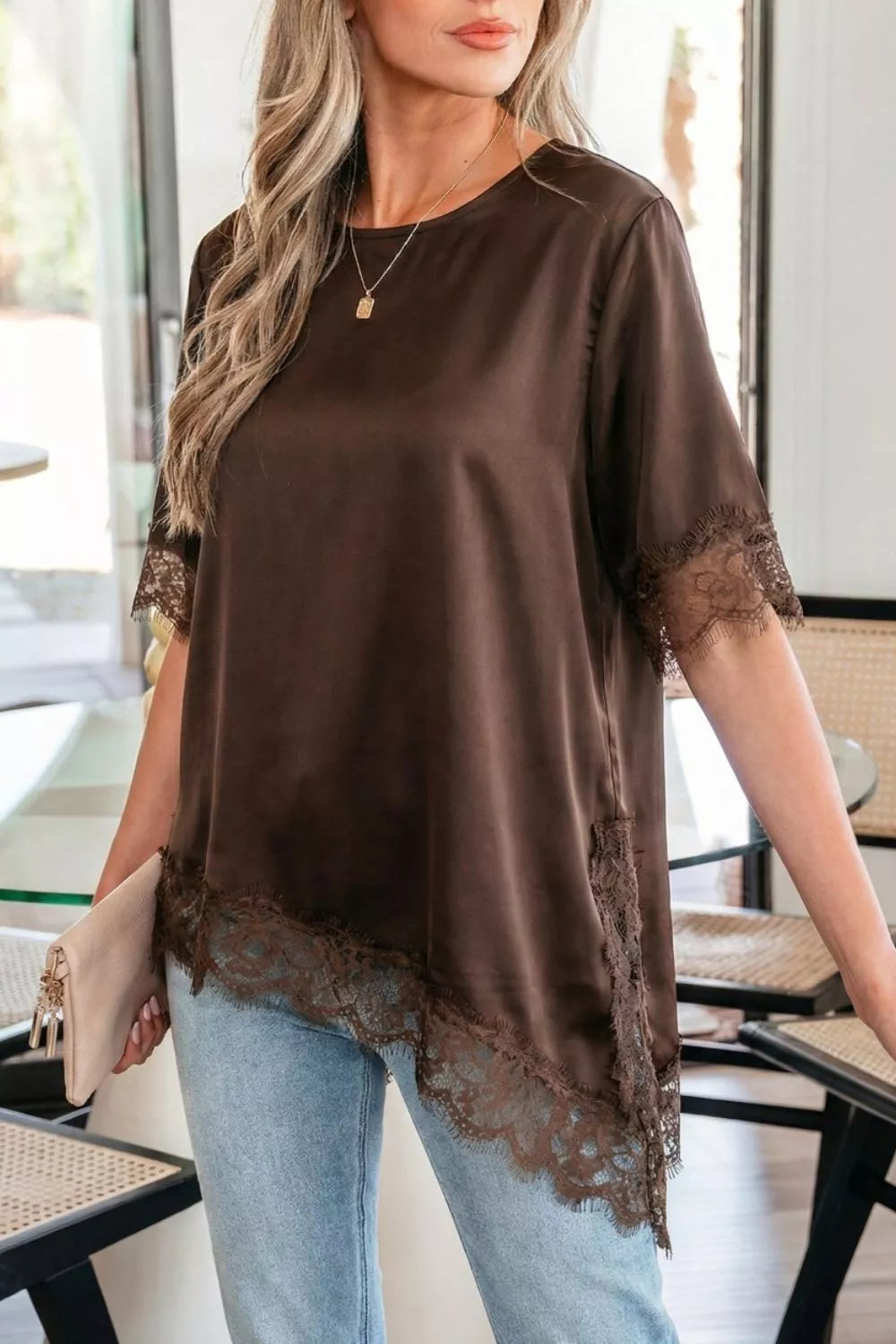 Brown satin maternity blouse with lace trim on asymmetric hem and sleeves.