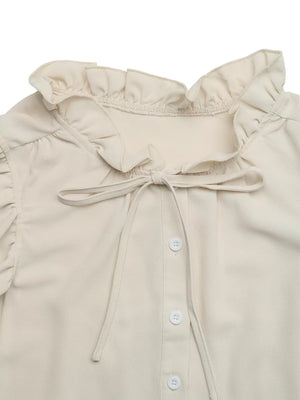 Beige ruffle tie-neck maternity overshirt with button front and ruffle sleeves.