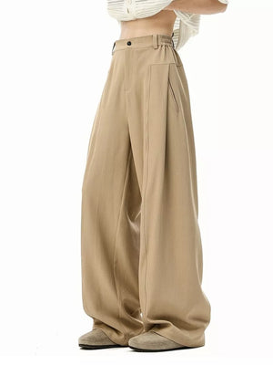 Men's khaki wide-leg track pants with elastic waistband and side pockets.