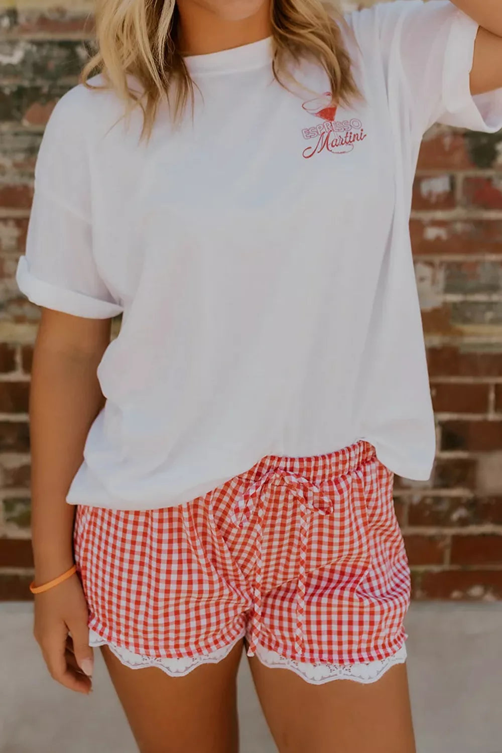 Gingham tie-waist shorts with lace trim, red and white pattern, cotton blend.