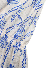 White maternity romper with blue seashell and wave print, cinched waist detail