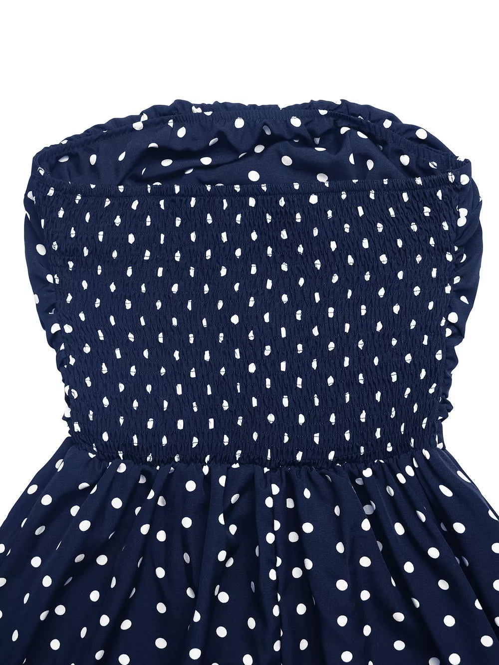Navy polka dot strapless maxi dress with smocked bodice and ruffled neckline.