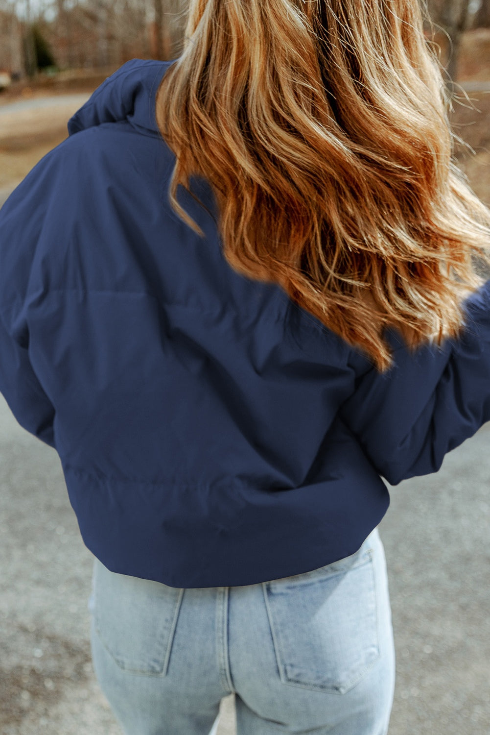 Padded crop jacket in cobalt blue with stand collar, shown from the back.