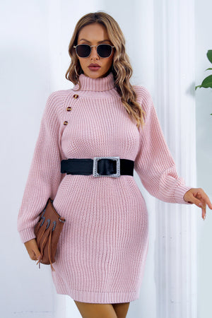 Pink knit turtleneck mini dress with button detail and black belt.
