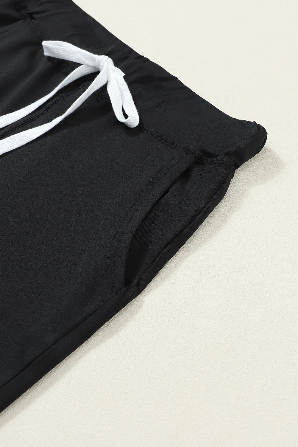 Black joggers with drawstring and side pocket detail