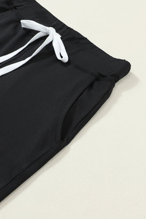 Black joggers with drawstring and side pocket detail