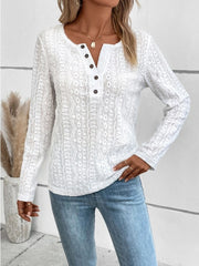 White textured henley long sleeve top with button detail and open knit pattern.