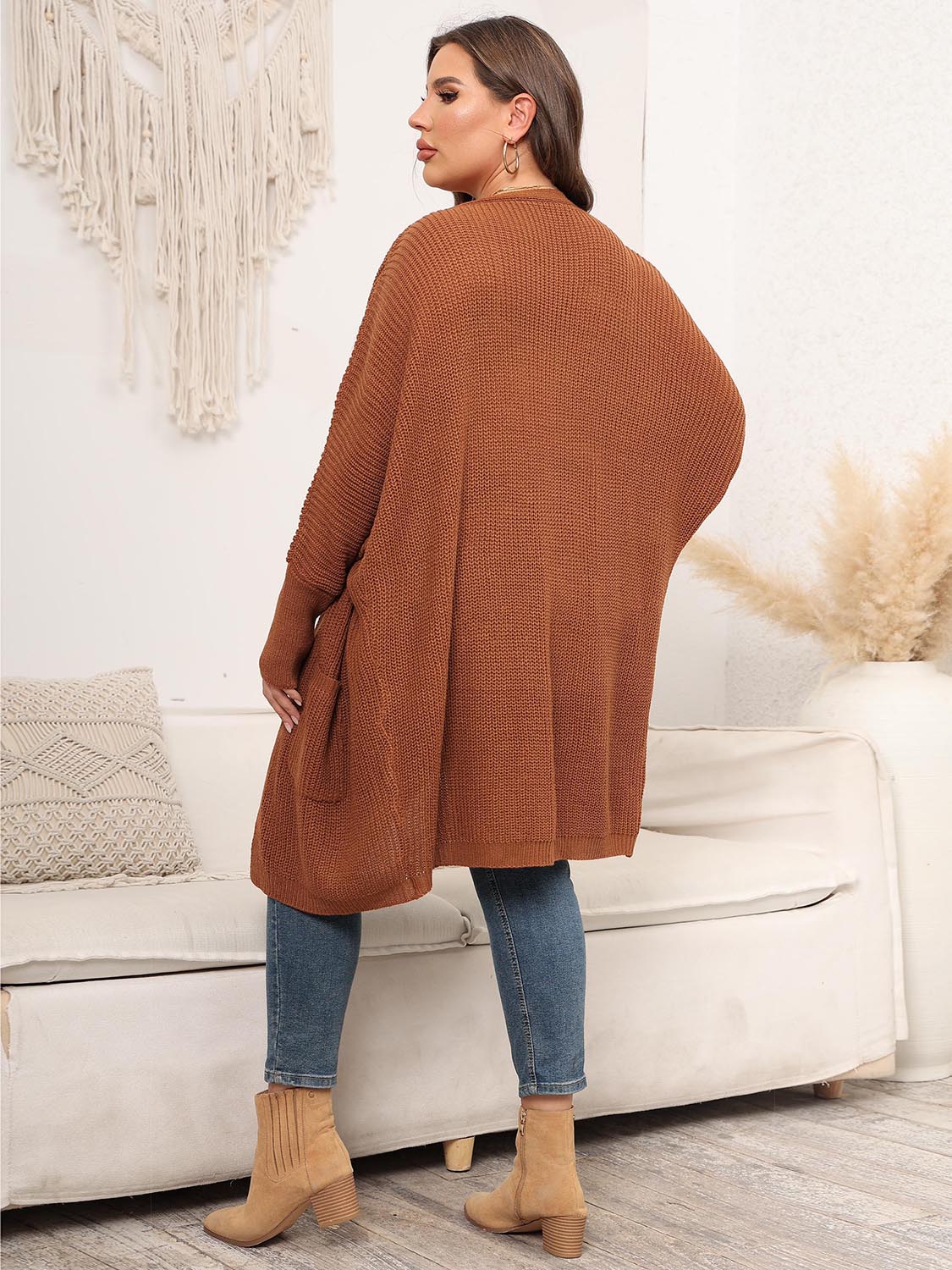 Oversized ribbed knit duster cardigan in ochre with pockets and dolman sleeves.