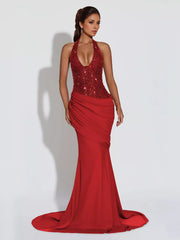 Scarlet sequin halter neck maxi gown with draped skirt and train.