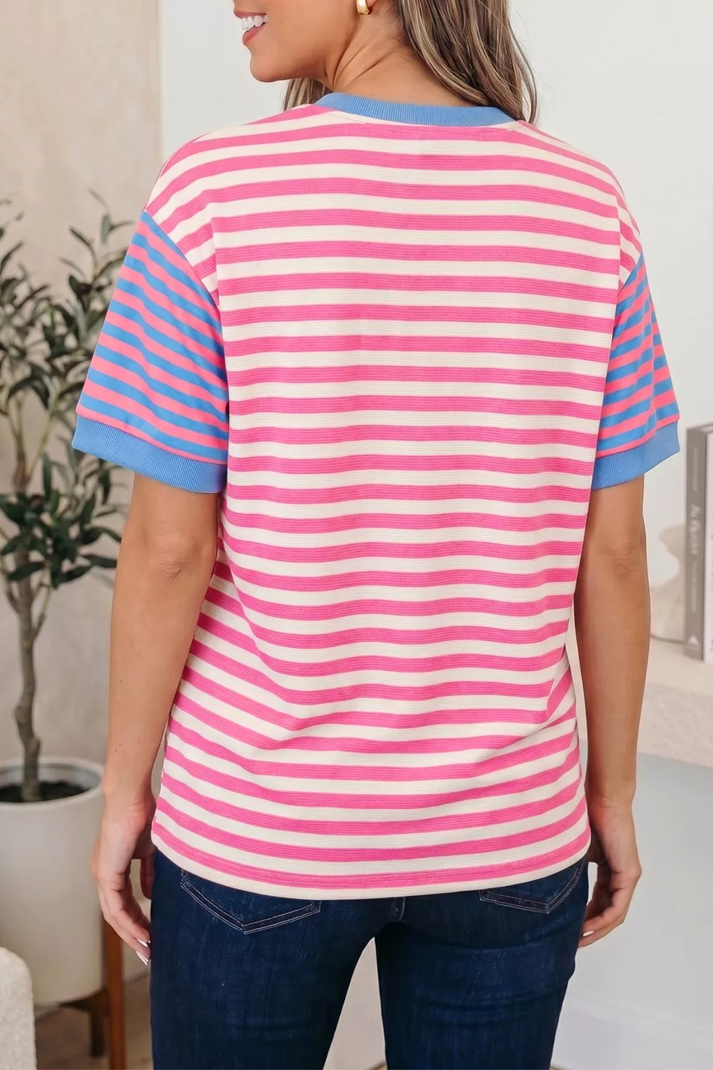 Women's short sleeve tee with pink, white, and blue stripes in polyester.
