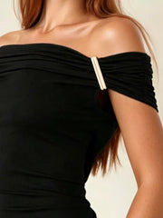 Black off-shoulder ruched t-shirt with gold buckle detail on sleeve.
