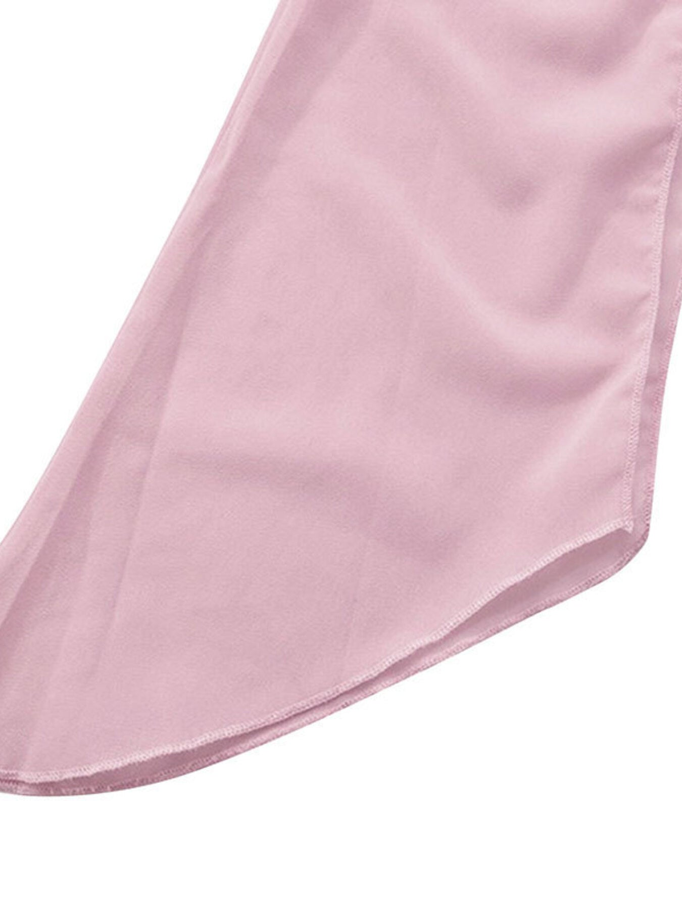 Pink chiffon mini dress detail showing draped fabric and hem.