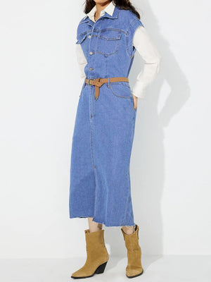 Sleeveless medium wash denim midi dress with button front and slit, belted at waist.