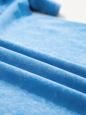 Mineral washed blue cotton t-shirt with a crew neck and casual oversized fit.