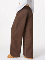 Brown corduroy maternity cargo pants with a relaxed fit and wide leg.