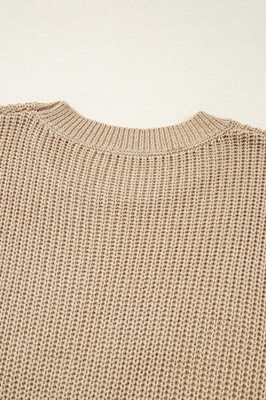 Tan acrylic knit tank top with crew neck and textured stitch detail.