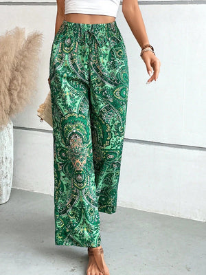 Paisley palazzo trousers in dark green with drawstring waist and wide leg