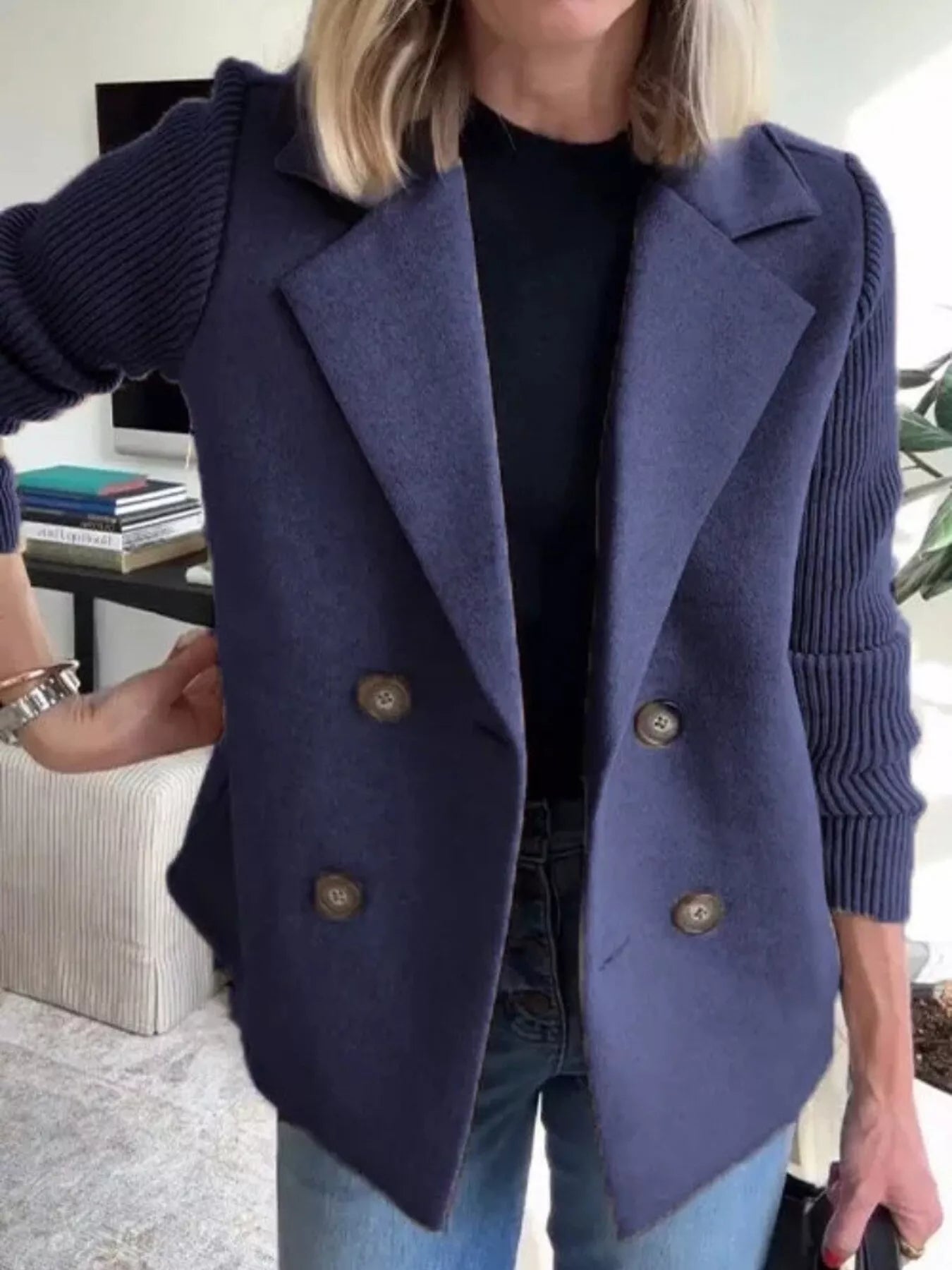 Navy double-breasted wool blend blazer with contrasting knit sleeves and button details.