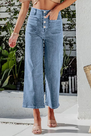 Button-front cropped wide-leg jeans in light blue denim with utility pockets.