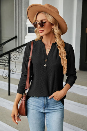 Black textured henley blouse with button detail and v-neck