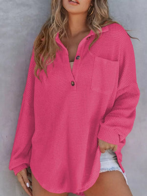 Waffle-knit Henley tee in dark pink with button detail and chest pocket.