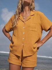 Yellow cotton button-up pajama set with collared shirt and shorts.