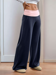 Navy palazzo pants with a pink contrast waistband