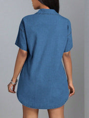 Medium wash denim oversized shirt dress with short sleeves and a collared neckline.