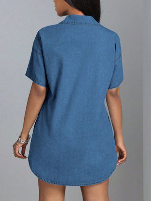 Medium wash denim oversized shirt dress with short sleeves and a collared neckline.