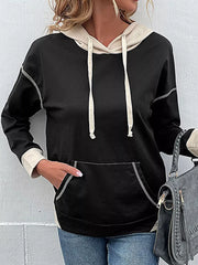 Black cotton hoodie with beige contrast details, drawstring, and contrast stitching.