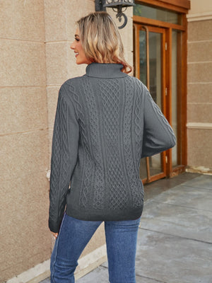 Charcoal cable knit turtleneck sweater with textured pattern.